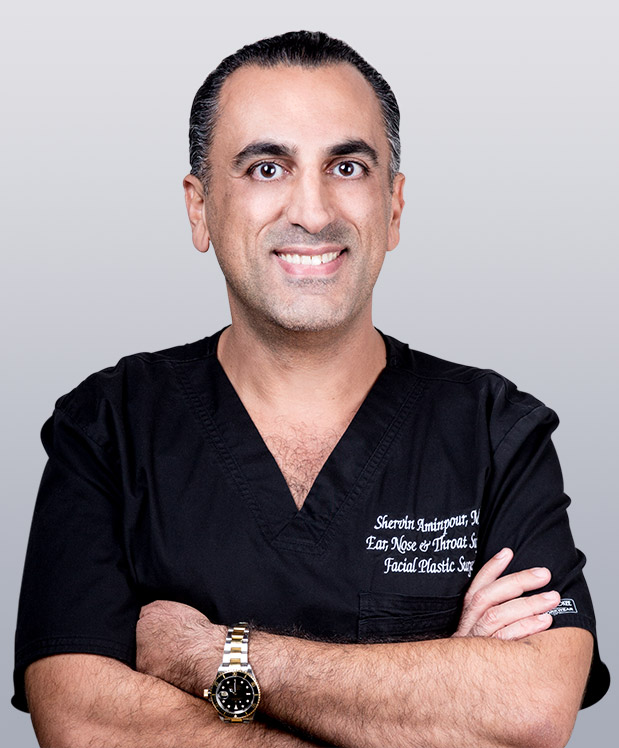 Dr. Aminpour Smiling and Crossing his arms