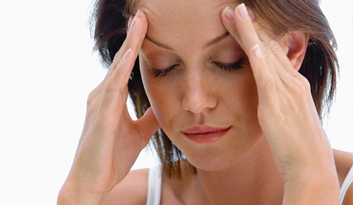 Woman Rubbing forehead